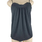 black tank top on a mannequin against a white background