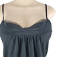 black tank top on a mannequin against a white background