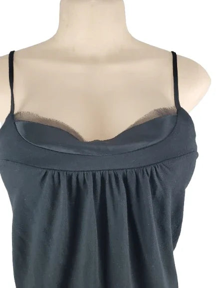 black tank top on a mannequin against a white background