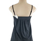 Black tank top on a mannequin with a white background