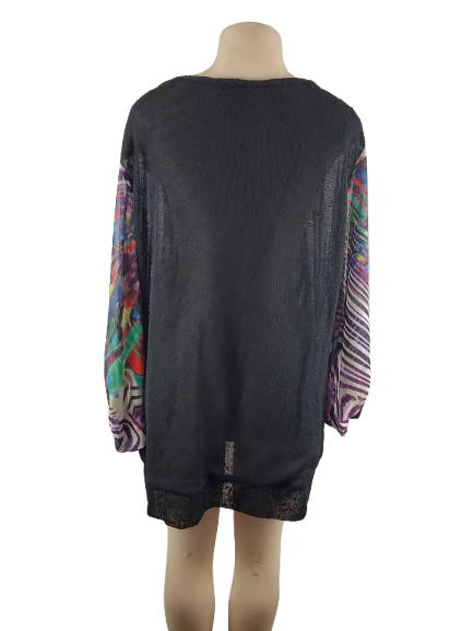 Black dress with colorful sleeves on a mannequin against a white background