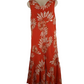 orange dress with white floral pattern on a mannequin against a white background