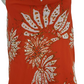 orange dress with white floral pattern on a mannequin against a white background