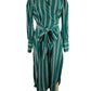 Green and white striped dress on a mannequin against a white background