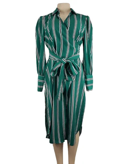 Green and white striped dress on a mannequin against a white background