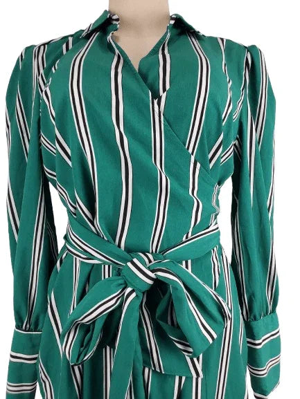 Green and black striped dress on a mannequin with a white background