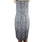 Blue and white patterned dress on a mannequin against a white background
