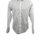 White dress shirt on a mannequin against a white background