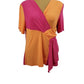Mannequin wearing a two-tone pink and orange top on a white background