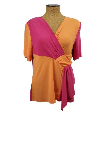 Mannequin wearing a two-tone pink and orange top on a white background