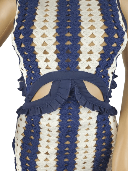 Blue and white striped crochet dress with a bow detail on a mannequin.