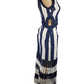 Mannequin wearing a blue and white striped dress with cut-out design on a white background