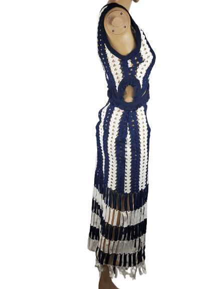 Mannequin wearing a blue and white striped dress with cut-out design on a white background
