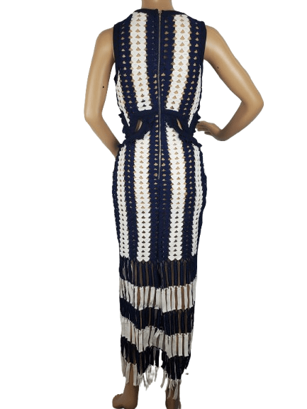 Mannequin wearing a sleeveless dress with black and white striped pattern on a white background