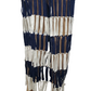 Textile with blue, white, and brown pattern on a mannequin against a white background