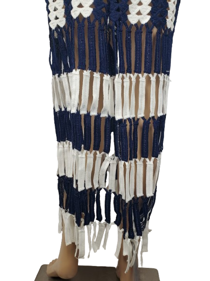 Textile with blue, white, and brown pattern on a mannequin against a white background