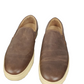 Pair of brown leather shoes on a white background