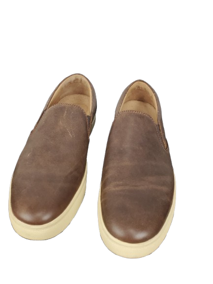 Pair of brown leather shoes on a white background