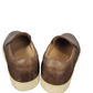 Pair of brown leather shoes on a white background