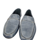 Pair of blue loafers on a white background