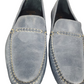 Pair of light blue loafers on a white background