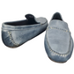 Pair of blue loafers on a white background