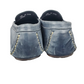 Pair of blue loafers on a white background