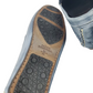 Close-up of a shoe sole with 'Allen Edmonds' branding on a white background
