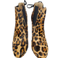 Pair of leopard print shoes on a white background