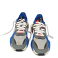 Pair of sneakers with blue, gray, and white design on a white background