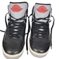 Black high-top sneakers with red logo on a white background