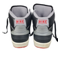 Pair of black and gray Nike sneakers on a white background