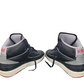 Pair of black and gray Nike sneakers on a white background