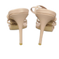 Beige high-heeled shoes on a white background