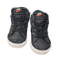 Pair of black Nike high-top sneakers on a white background