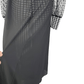 Black and white checkered jumpsuit with sheer sleeves on a mannequin against a white background