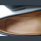 Close-up of a Gucci shoe sole with visible branding.