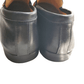 Pair of black leather shoes on a white background