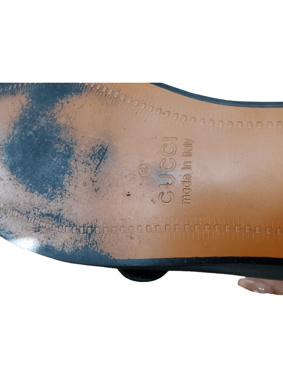 Gucci shoe sole with visible branding on a white background