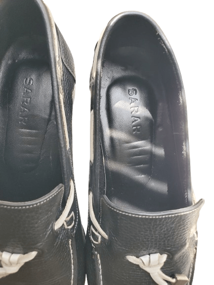 navy leather shoes with floral patterns on a white background