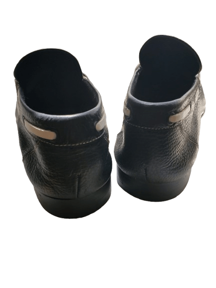 Pair of navy leather shoes on a white background