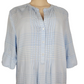 Light blue checkered shirt on a mannequin against a white background