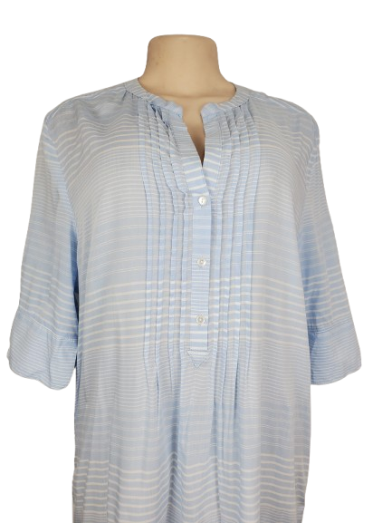 Light blue checkered shirt on a mannequin against a white background