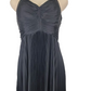 Black evening gown on a mannequin against a white background