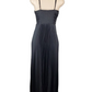 Black pleated dress on a mannequin against a white background