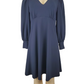 Blue dress on a mannequin against a white background