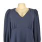 Navy blue dress on a mannequin against a white background