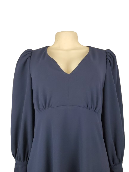 Navy blue dress on a mannequin against a white background