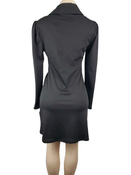 Black dress on a mannequin against a white background