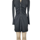 Black dress on a mannequin against a white background